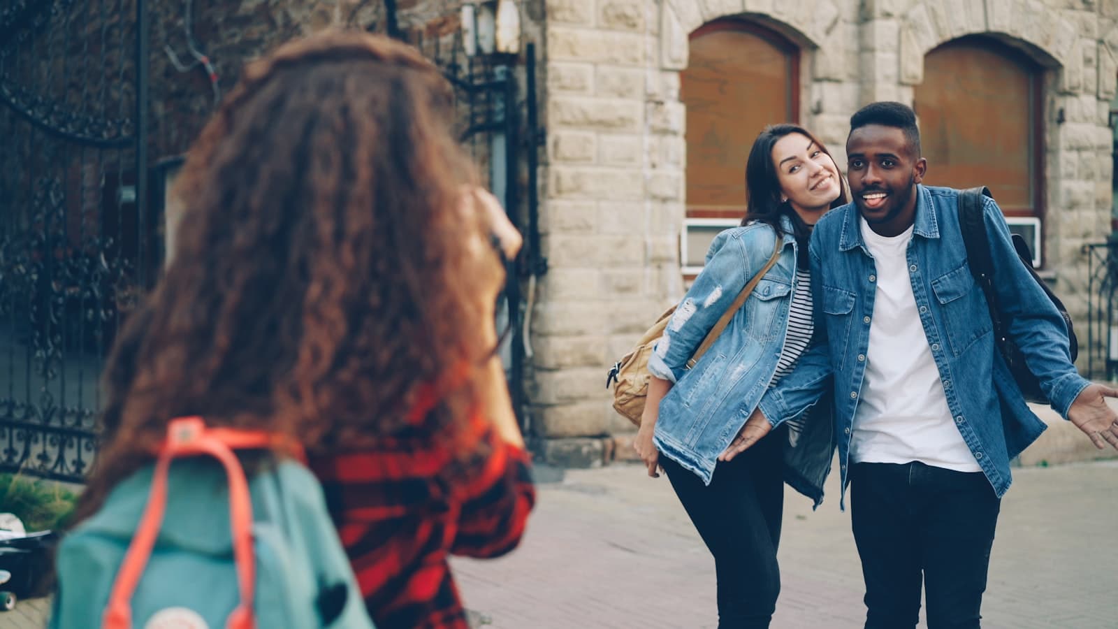 Students walking through a busy London street near a university campus